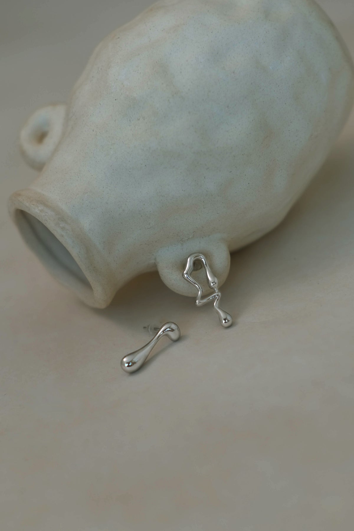 Asymmetrical Lava Earrings In Silver