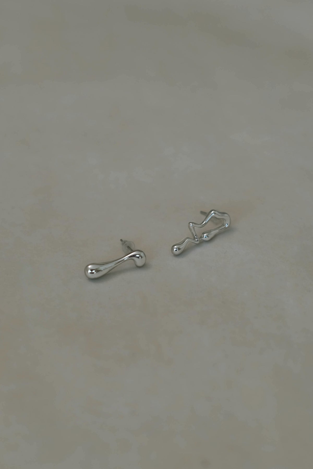 Asymmetrical Lava Earrings In Silver
