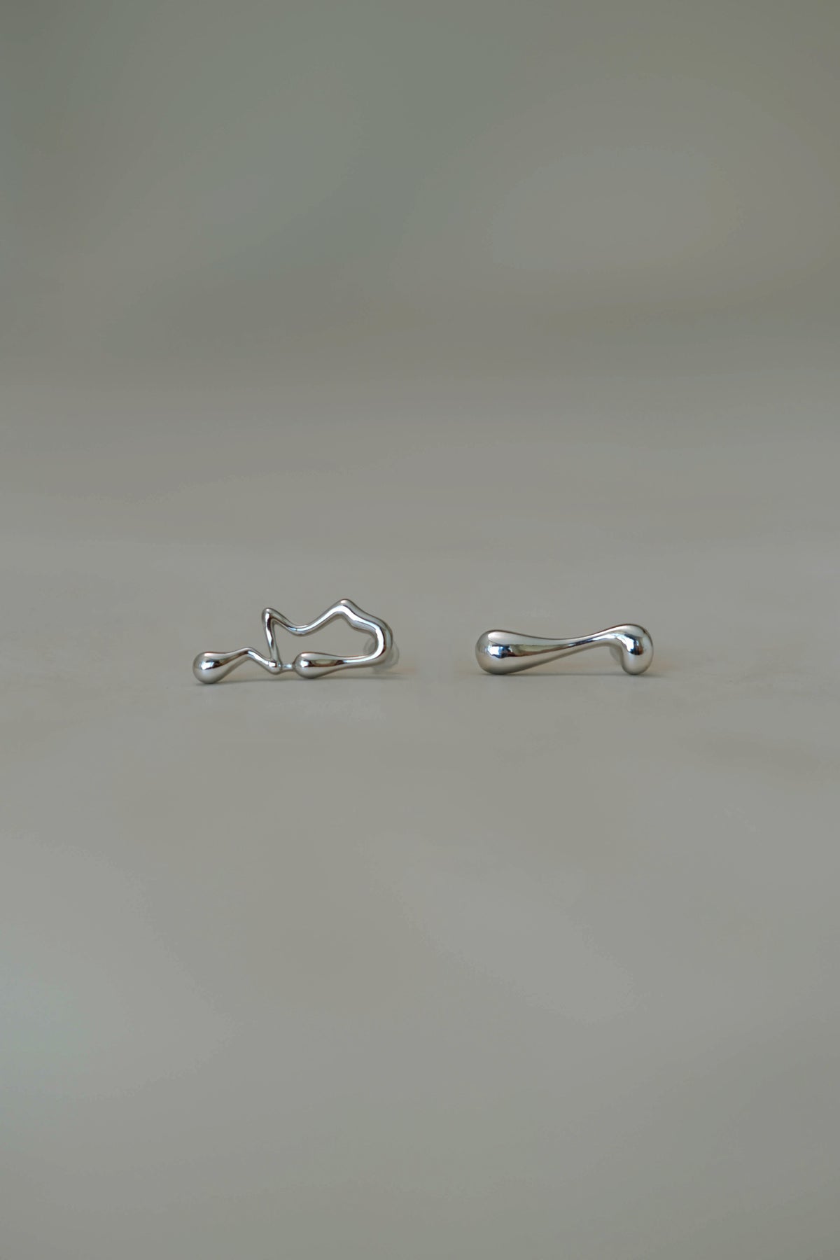 Asymmetrical Lava Earrings In Silver
