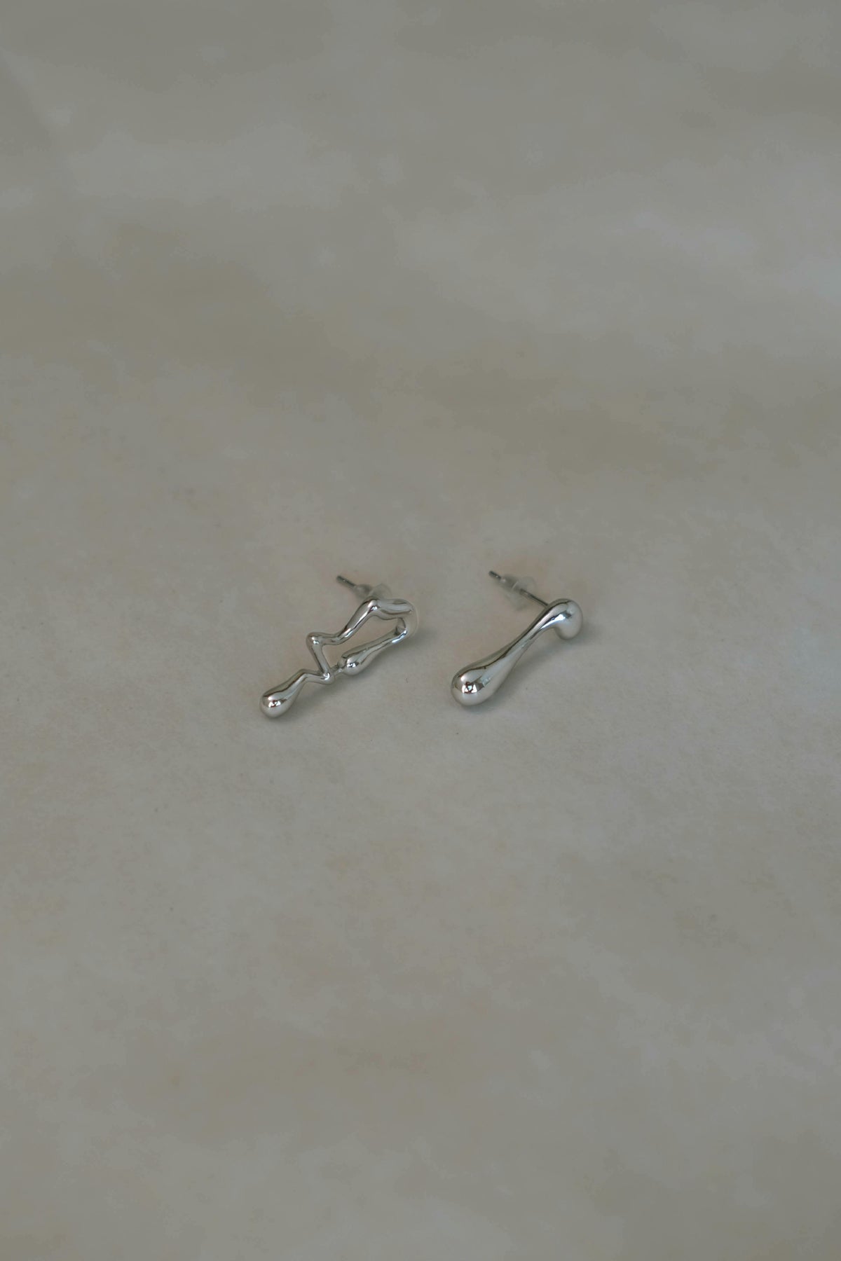 Asymmetrical Lava Earrings In Silver