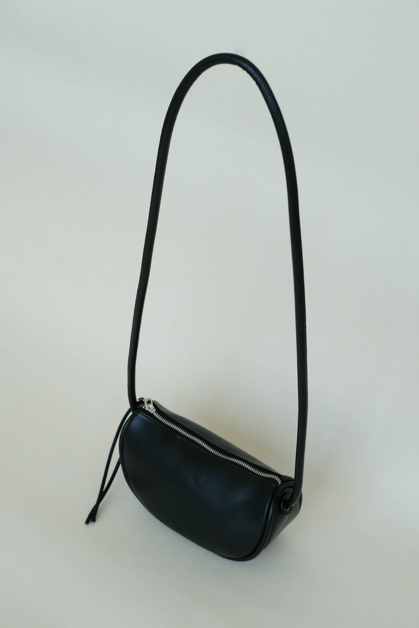 Half-moon saddle shoulder bag in classic black