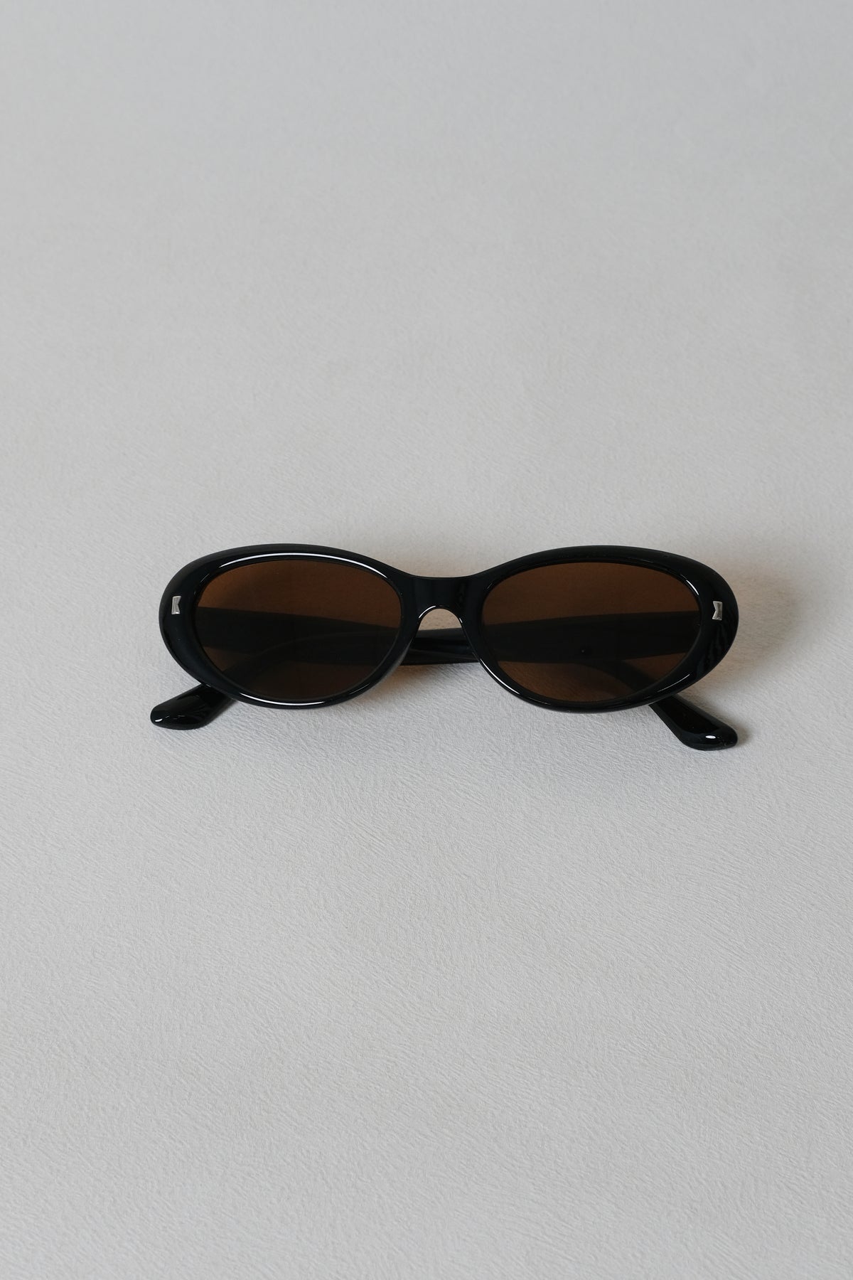 Lumière Oval Sunglasses - Black Frame + Brown Lenses
