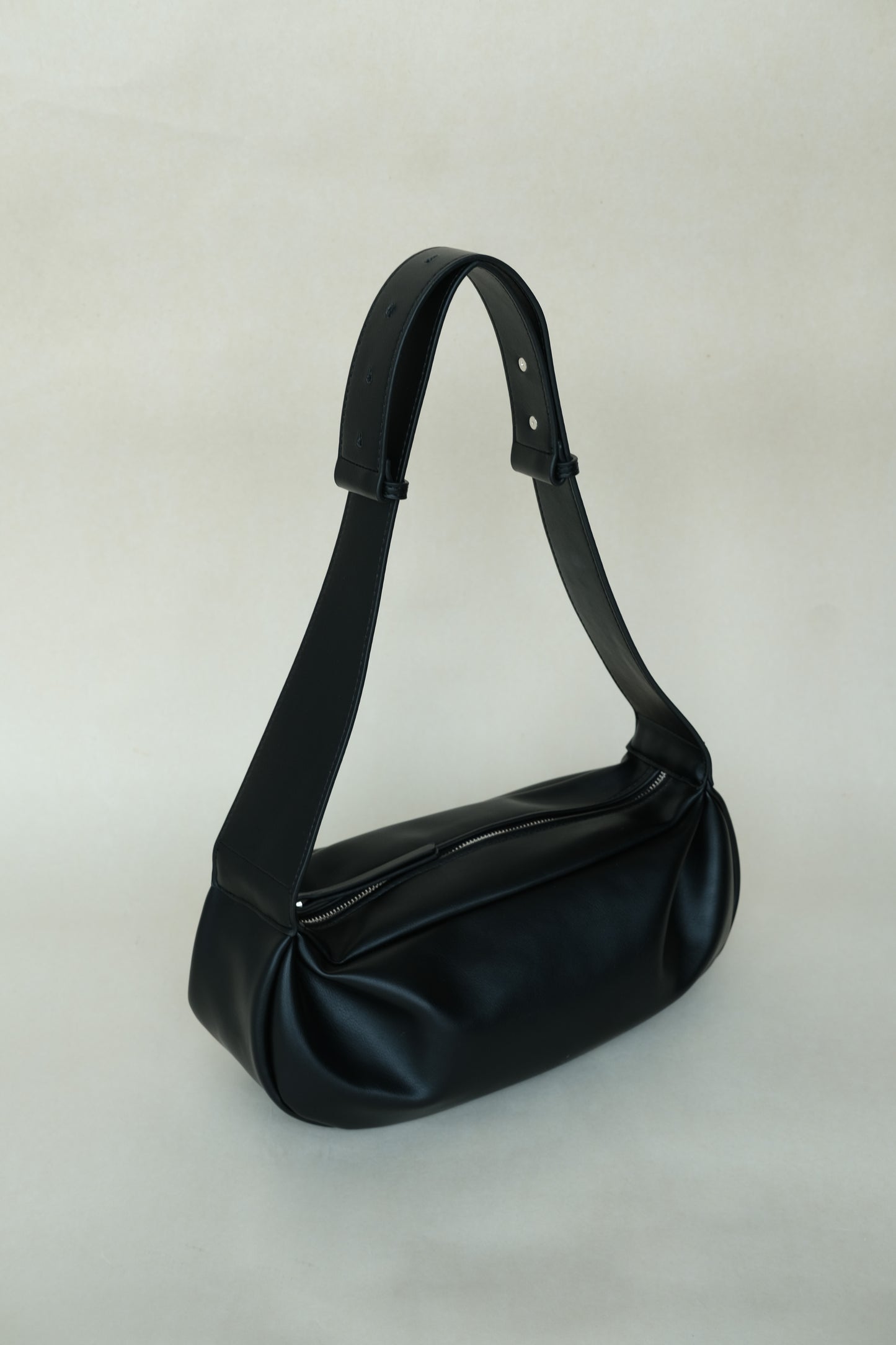 PU soft leather pillow bag in classic black