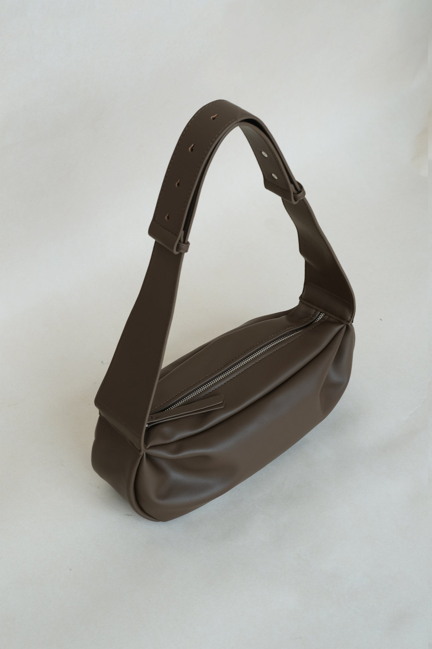 PU soft leather pillow bag in mud color
