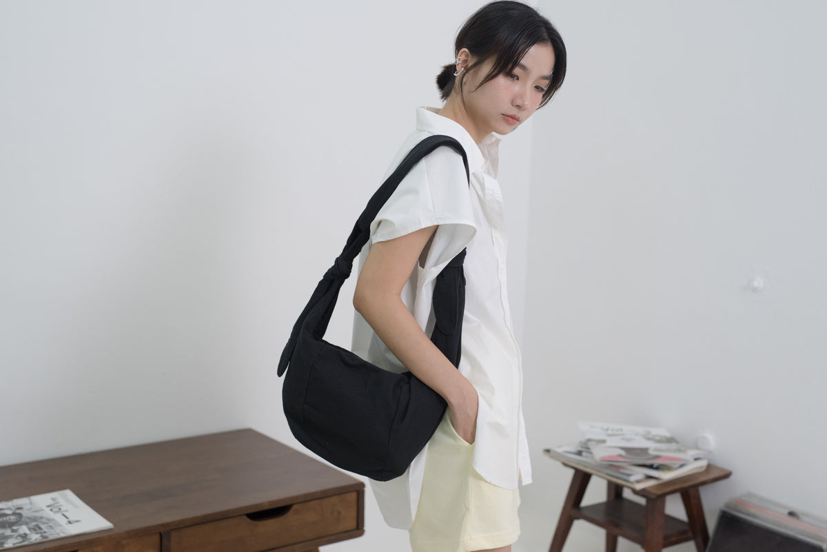 經典黑色帆布打結餃子
