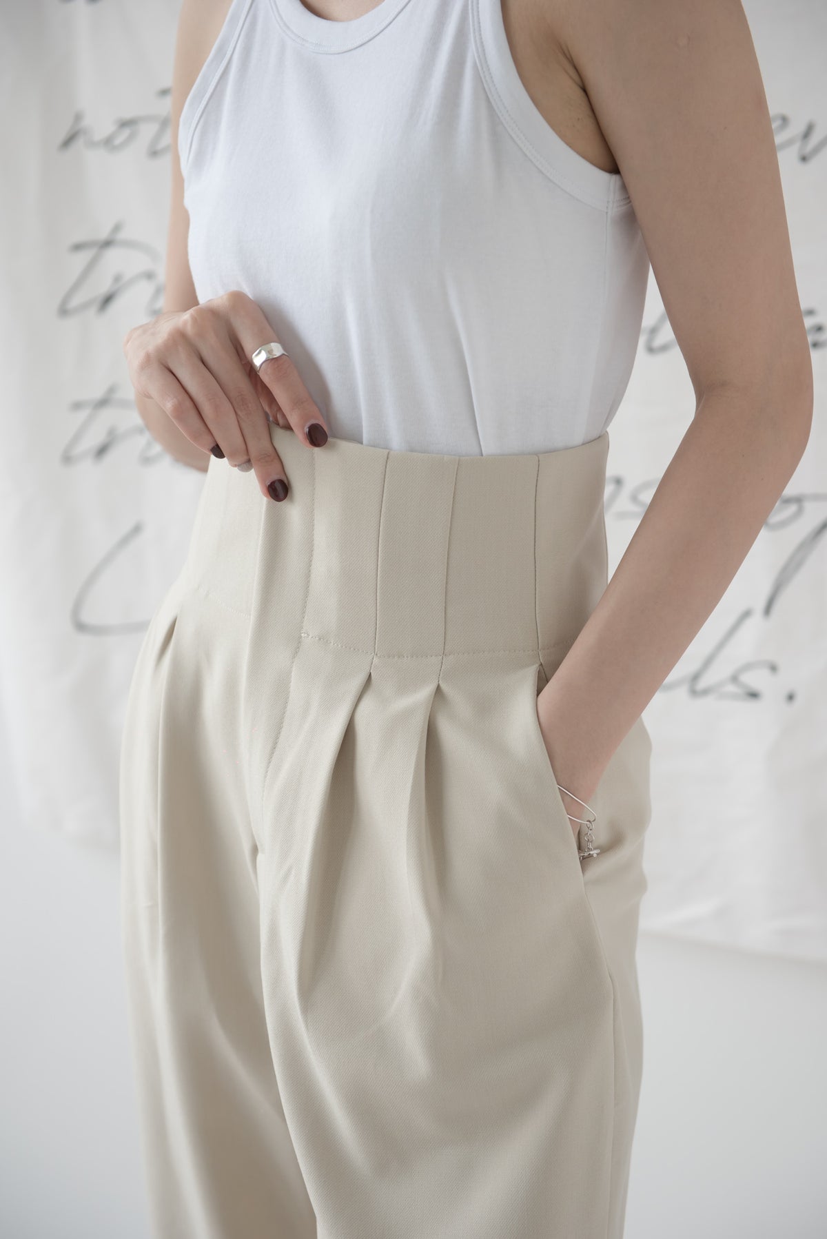 High-waisted wide-legged trousers
