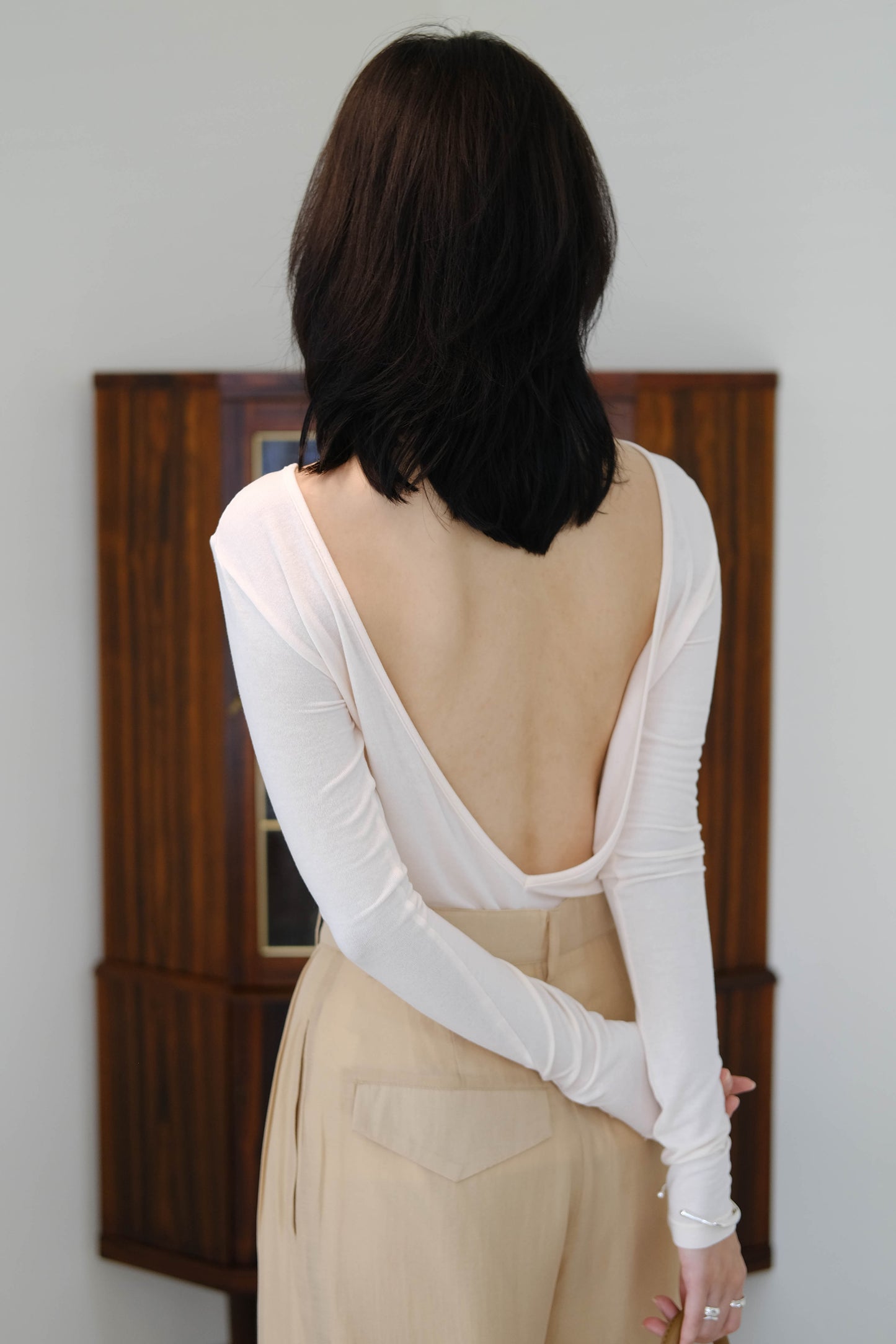 Open back stretch knit sweater in nude color