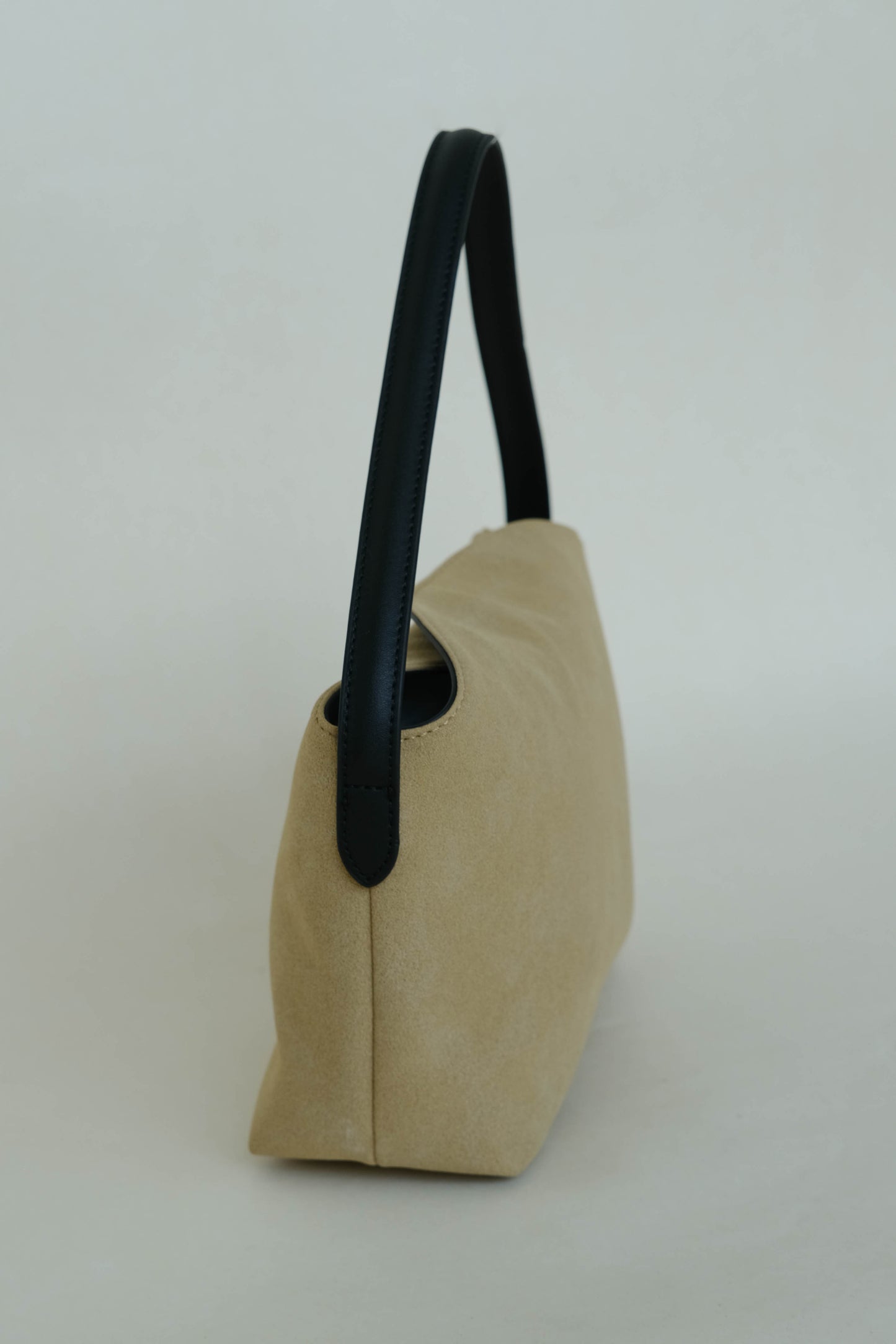 Matte finish single-strap shoulder bag in apricot color
