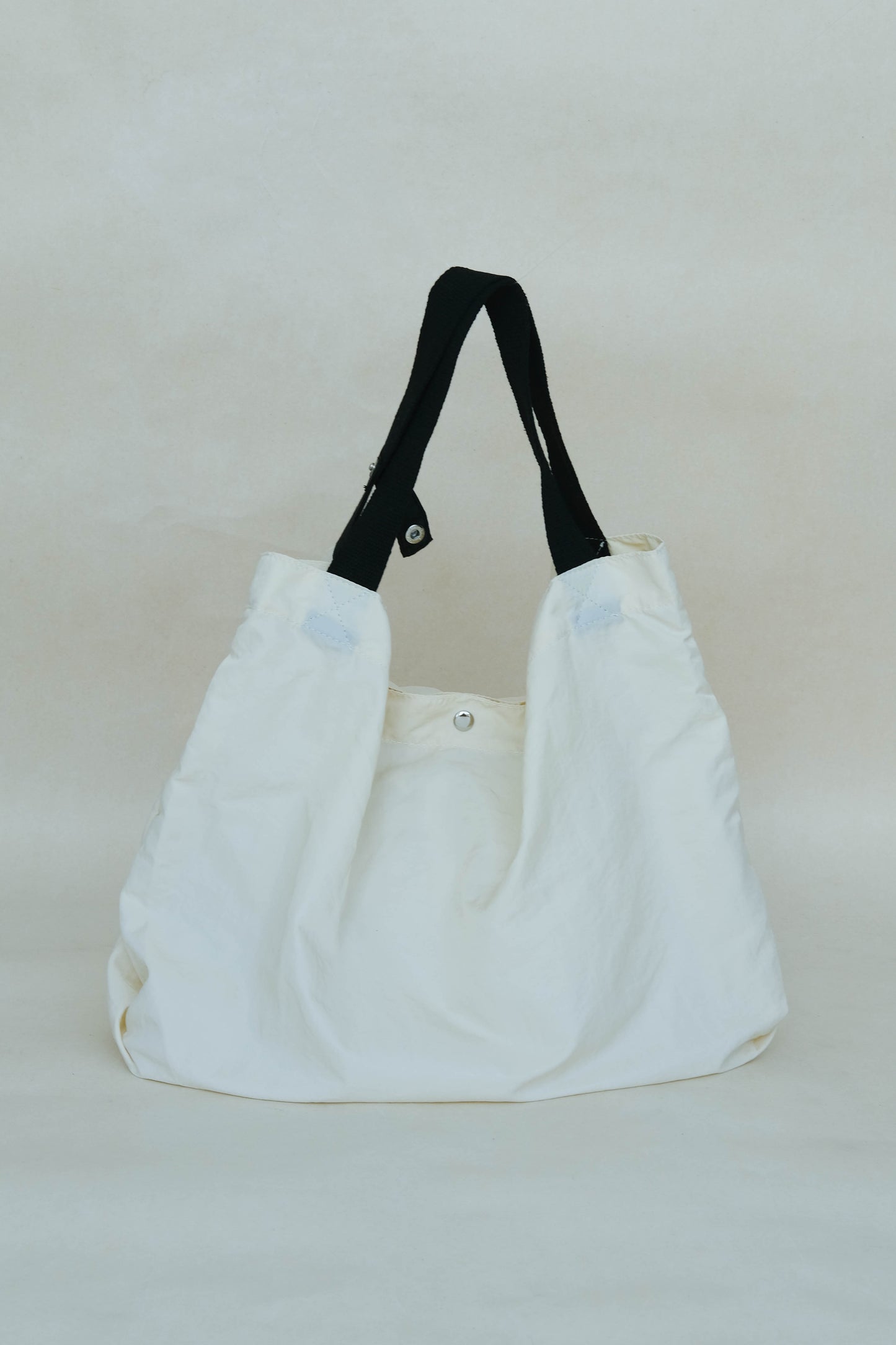Large capacity nylon cloth shoulder bag in off white color