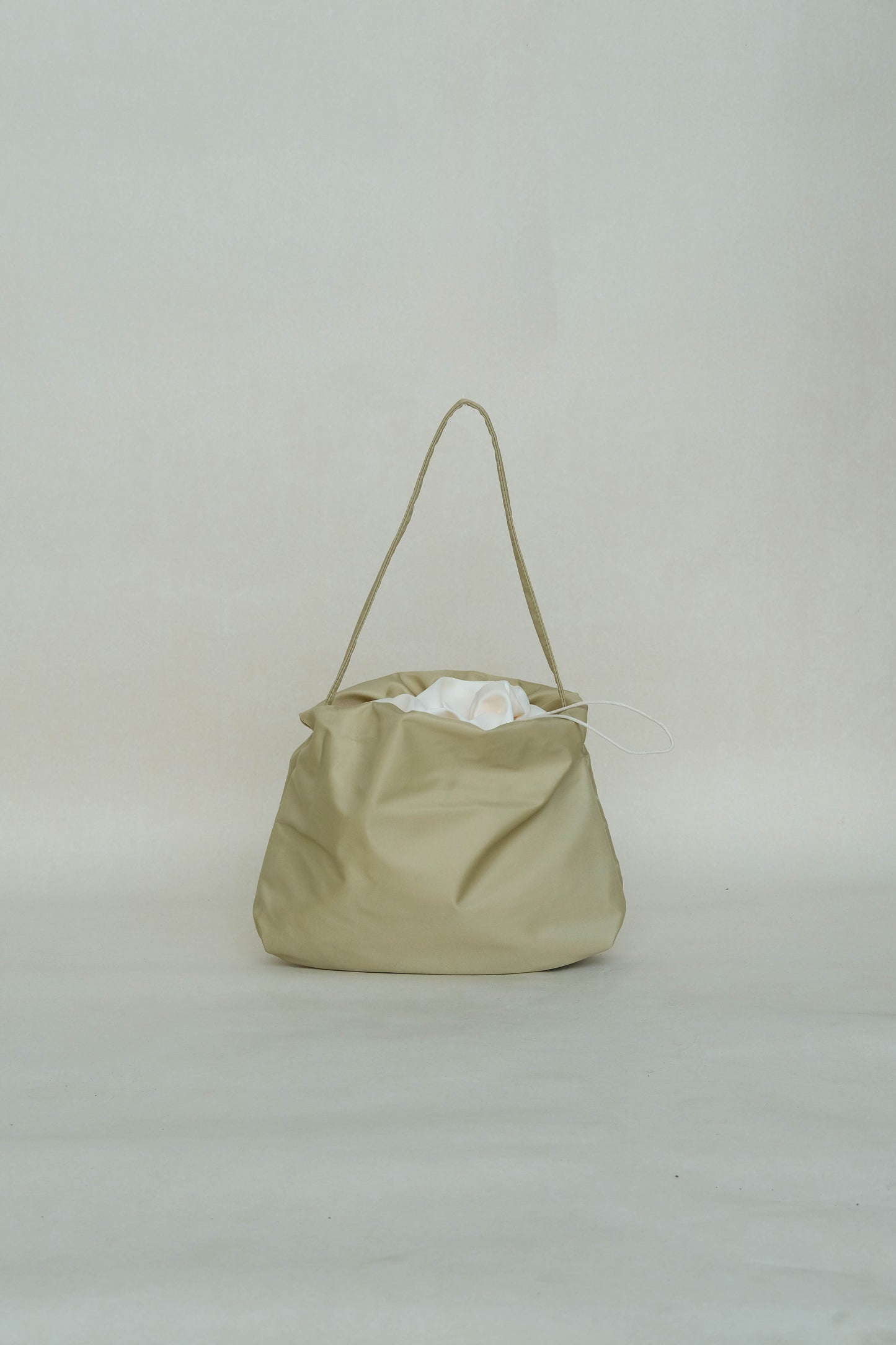 French nylon cloud pleated shoulder bag in apricot
