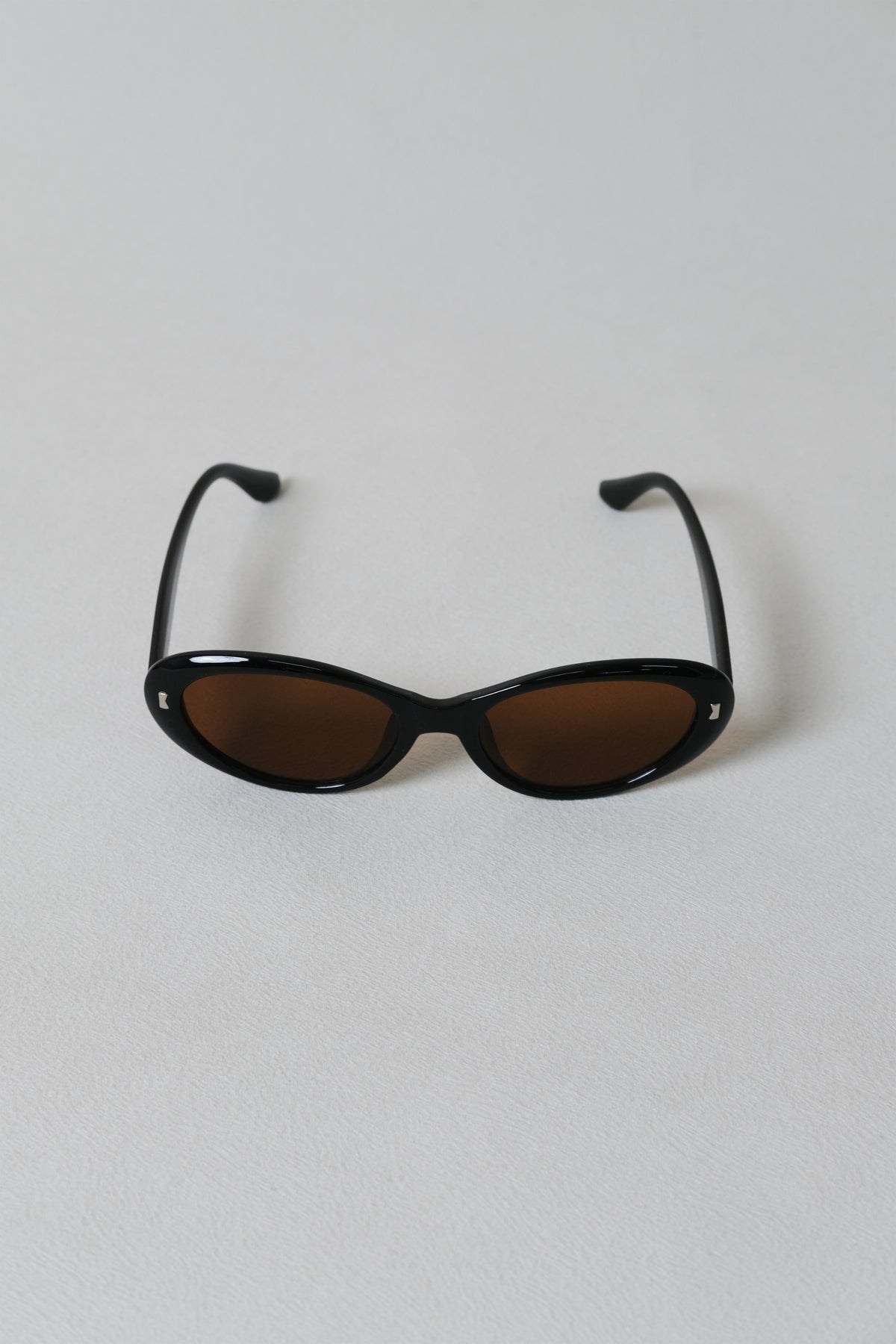 Lumière Oval Sunglasses - Black Frame + Brown Lenses