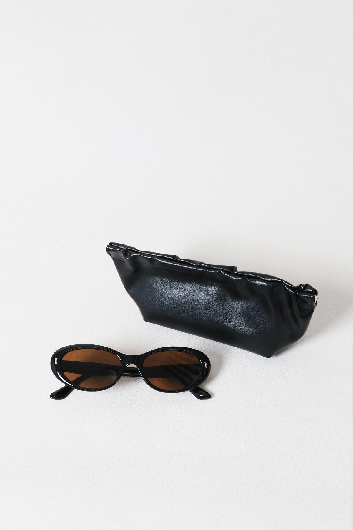 Lumière Oval Sunglasses - Black Frame + Brown Lenses