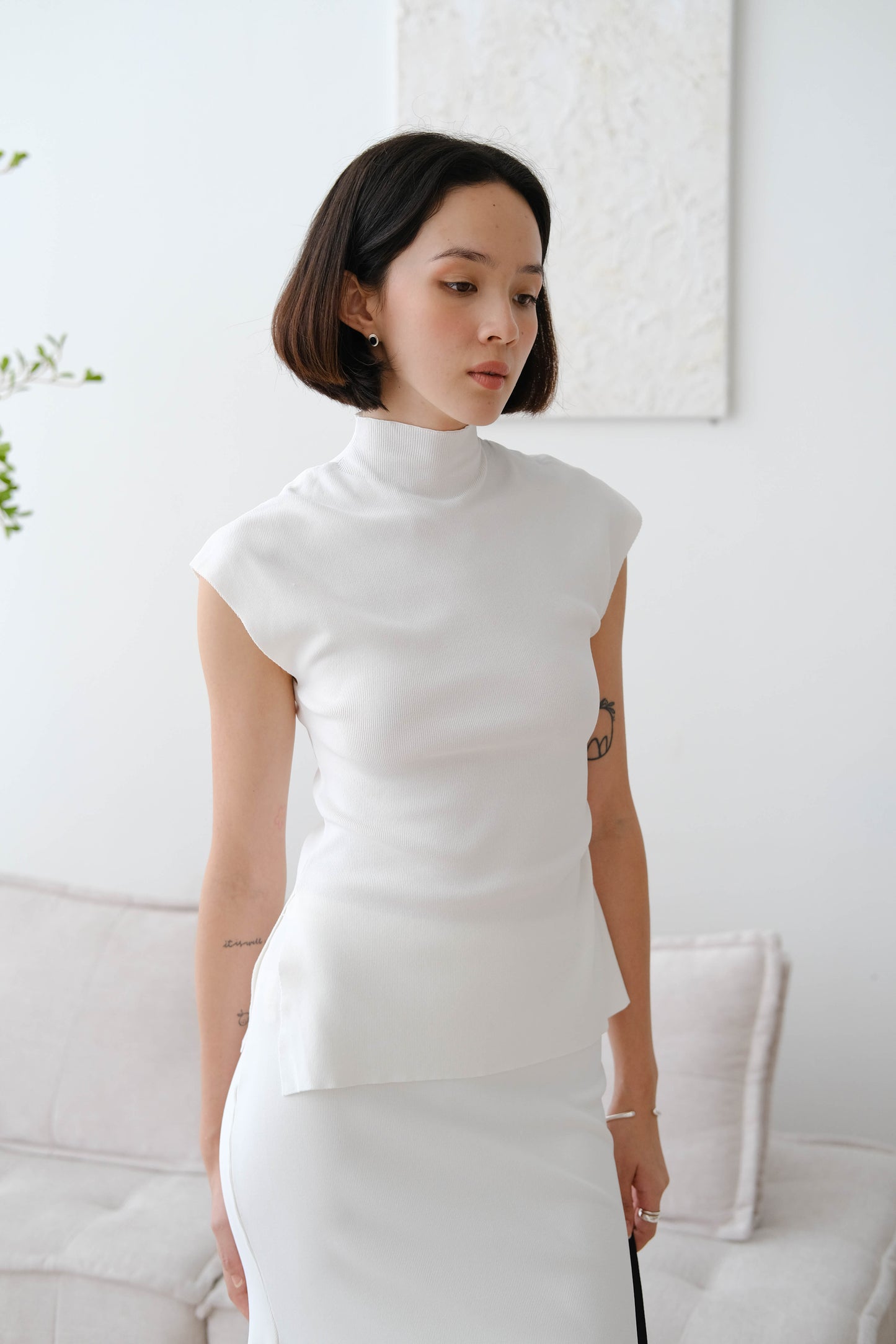 Stand collar top with sleeves in snow white color