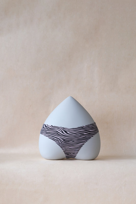 The Sleek Whisper Thong - Ivory Zebra Print