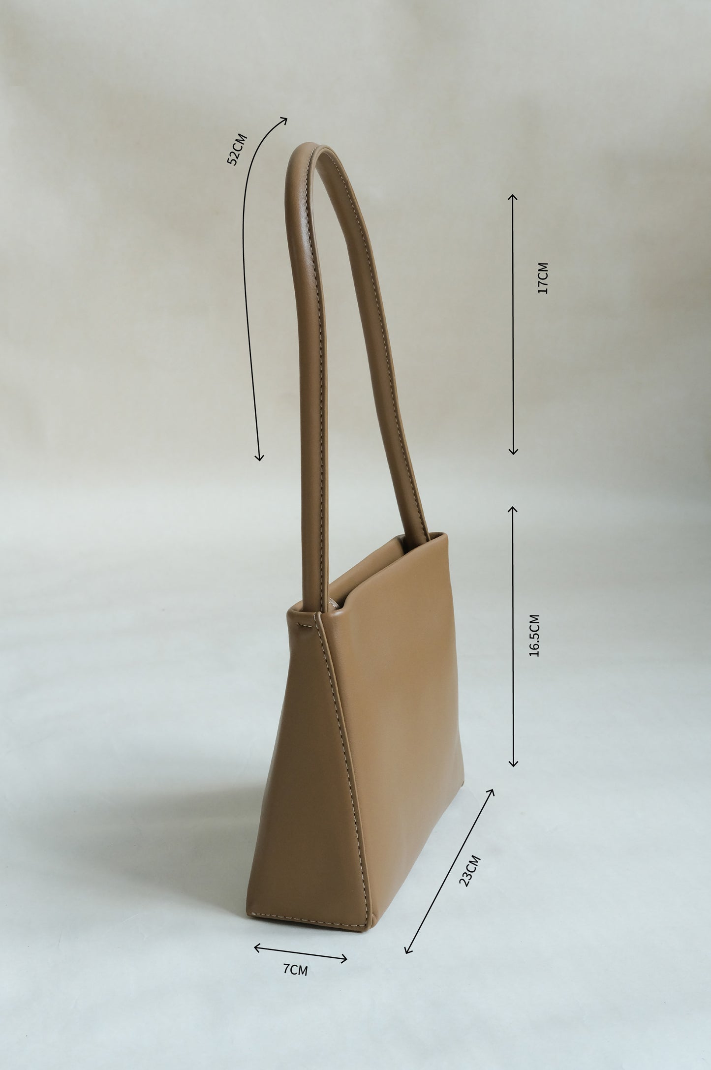 Square tote bag with one shoulder under the armpits in brown