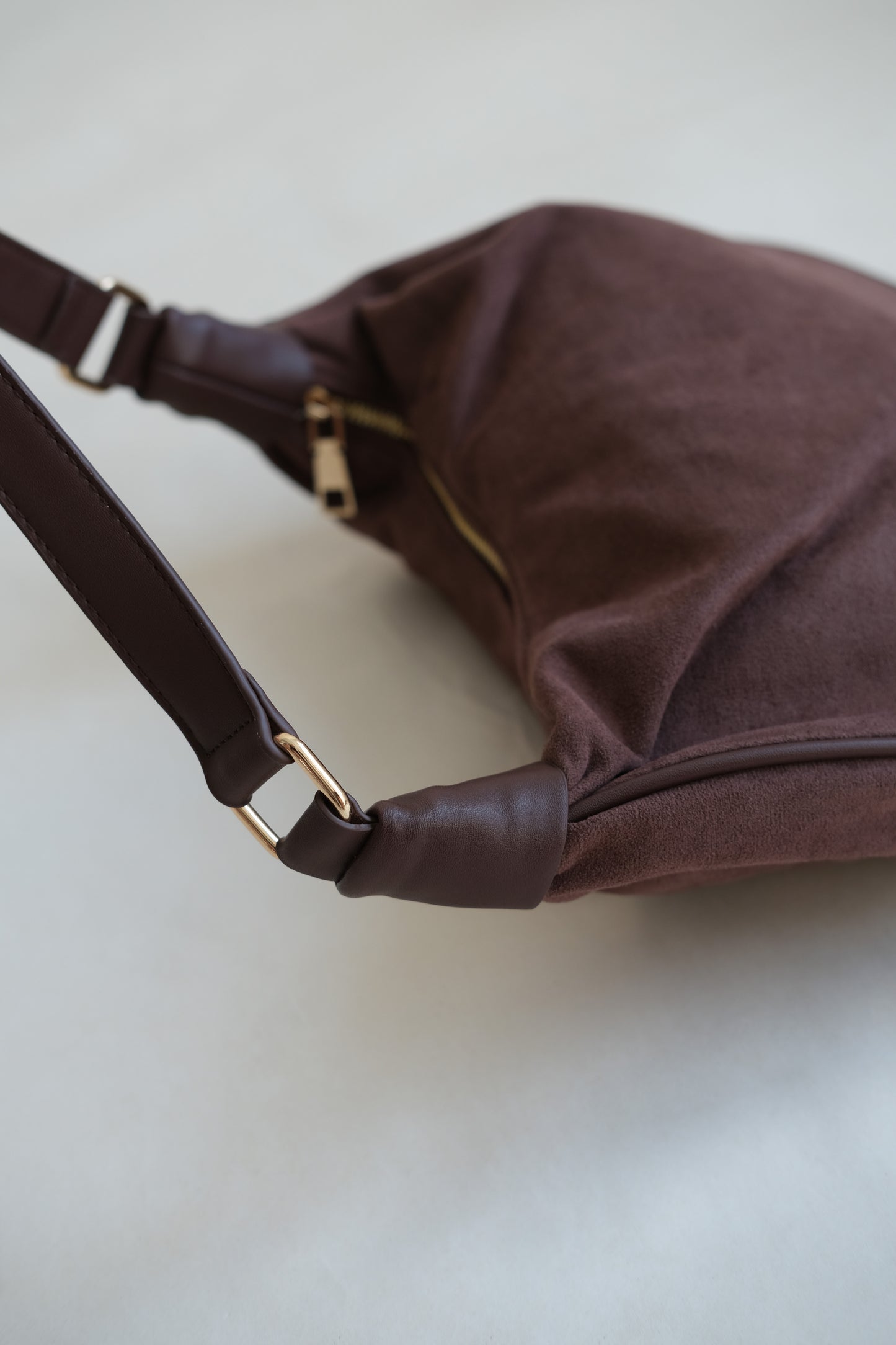 Underarm saddle dumpling bag in coffee color