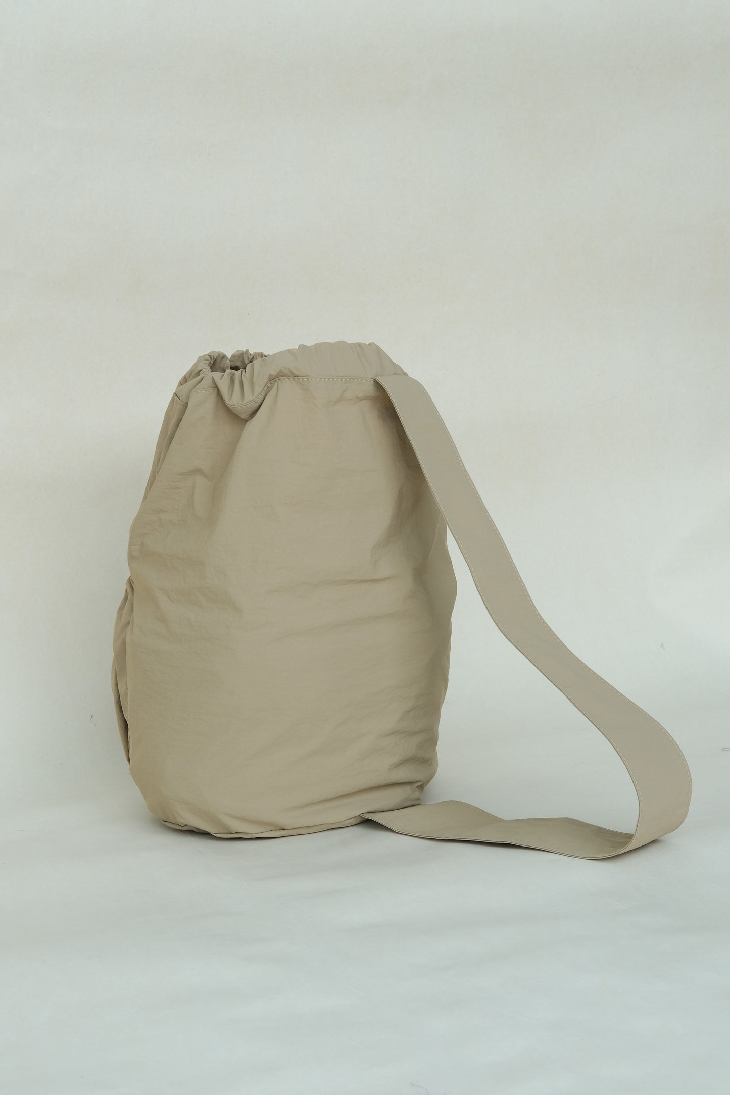 Unisex nylon high-capacity cross-body bag in clay color