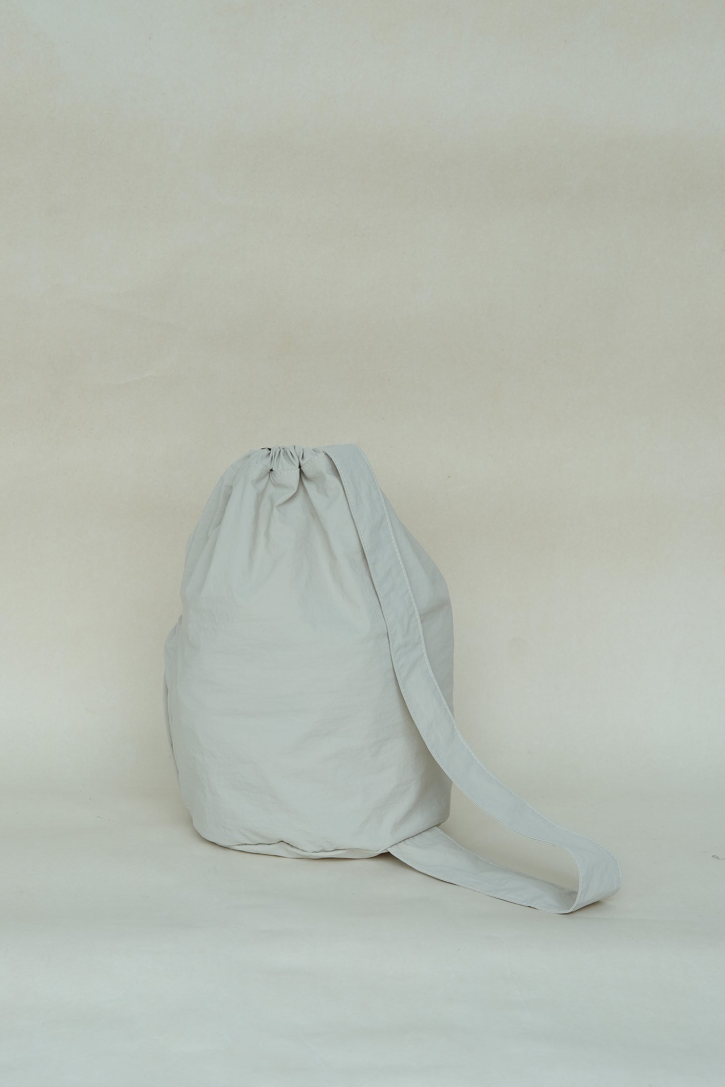 Unisex nylon high-capacity cross-body bag in light khaki
