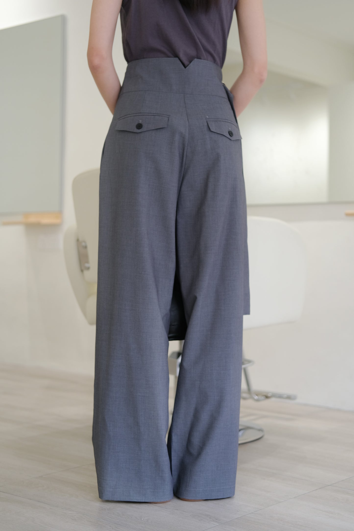 Adjustable button-up tabs and high-waisted wide-leg trousers in grey