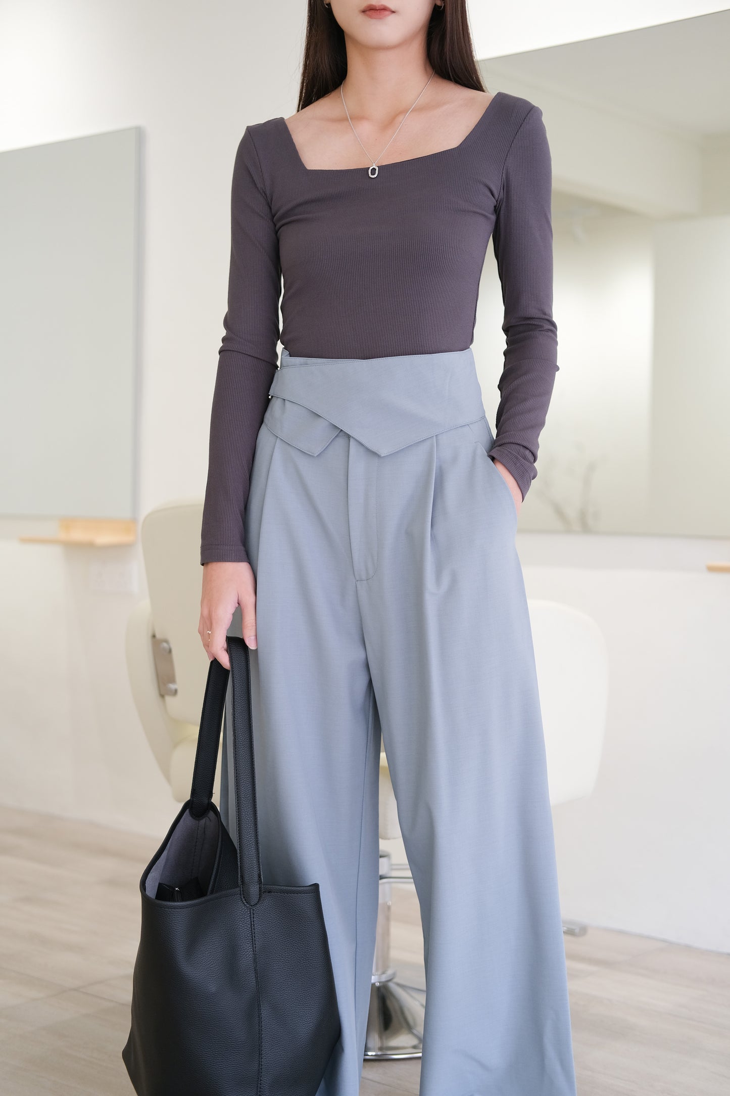 Adjustable button-up tabs and high-waisted wide-leg trousers in grey blue
