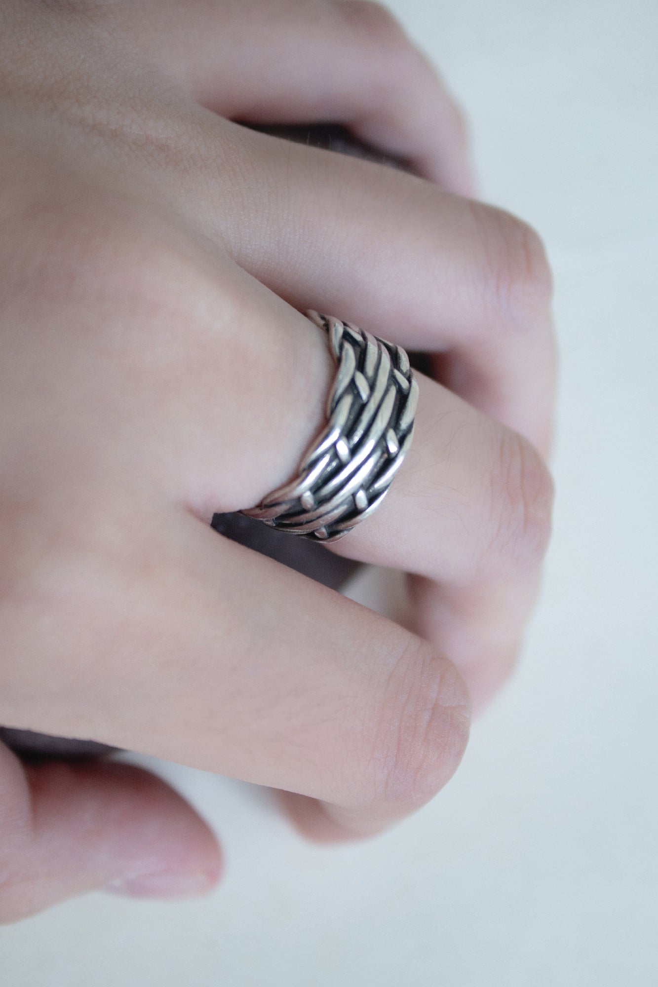 Woven knotted winding cross ring